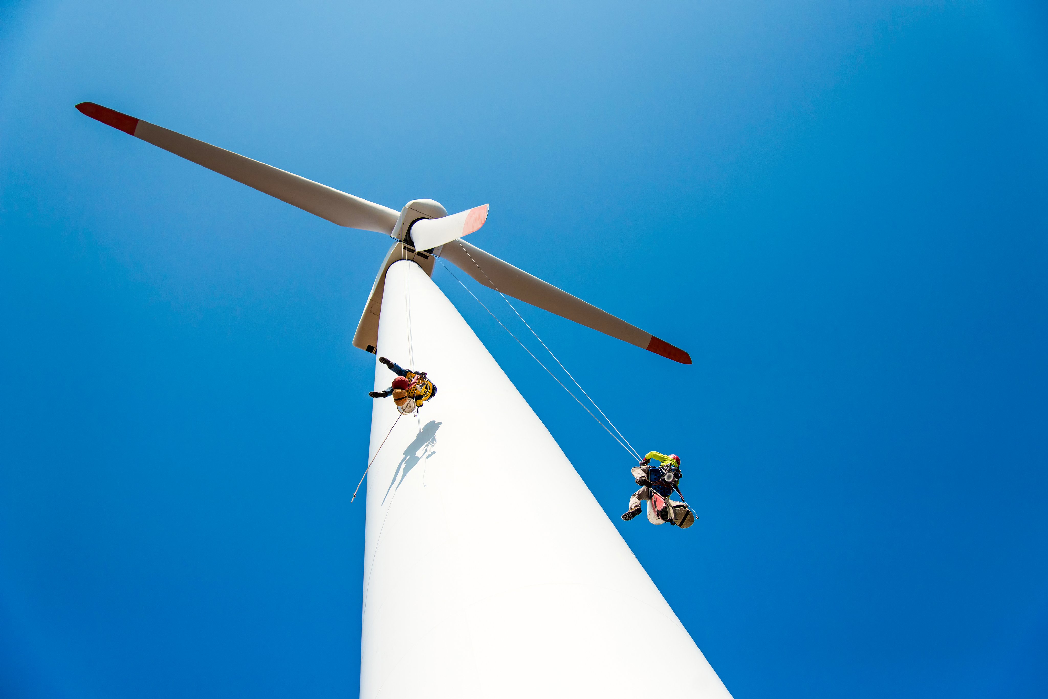 repair work on the blades of a windmill for electric power production - copy space