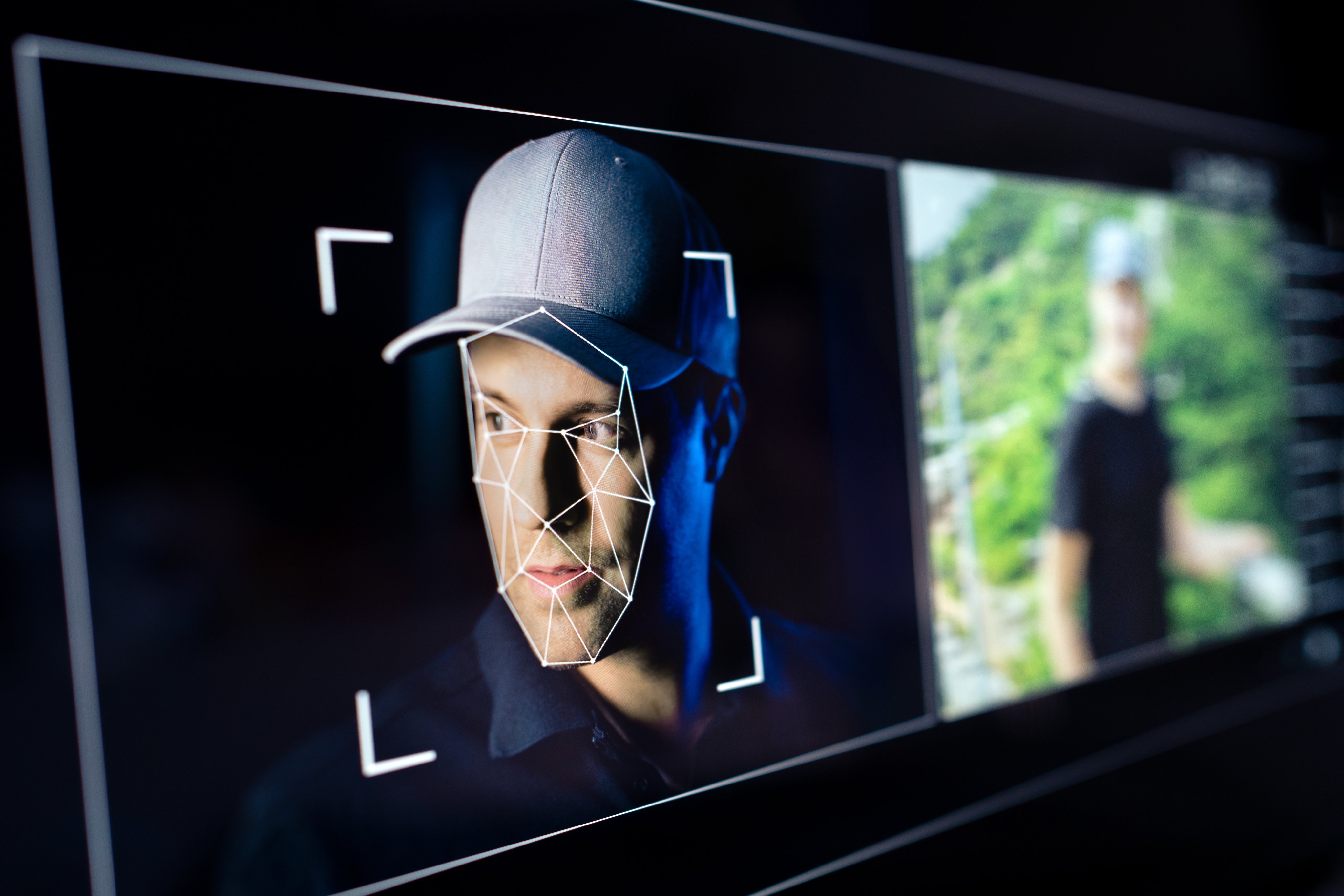 Deepfake, AI deep fake fraud or id scam. Face recognition. Identity theft with artificial intelligence technology. Video or photo editing with facial swap. People detection. Man in computer screen.