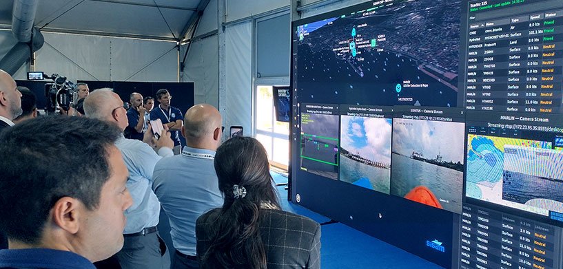 The NATO Innovation Continuum is a multifaceted exercise with the intention of taking concepts to combat readiness, turning ideas into impact for NATO forces. There are four stages to Innovation Continuum — SPARK, IGNITE, GLOW and SHINE — which act as NATO’s fast lane for emerging tech: scoping, testing and deploying solutions that meet today’s battlefield challenges and provide advantage and increased security for NATO countries.

SHINE 2025 showcased how NATO can use AI, autonomy and other emerging and disruptive technologies (EDTs) to counter real threats, from undersea sabotage to drifting mines to glide bombs.

Explore Hexagon’s geospatial solutions for defence

Technology demos
Hexagon took part in two technology demos, providing its Luciad SDK, with which Sefine Shipyard’s Unmanned Systems Research Center (SISAM) built a common operating picture (COP) used to show situational awareness for the demonstrations.

The first was for undersea infrastructure protection, testing how autonomous systems can safeguard the seabed infrastructure that underpins global communications, energy and security. Through real-time collaboration between underwater vehicles; intelligence, surveillance and reconnaissance (ISR) drones; and robotic patrols an insurgent boat was detected and prevented from causing any damage.

As part of the IC, this experiment demonstrated how diverse unmanned systems operating in GPS-denied environments can detect and neutralize drifting mines. By integrating advanced navigation and multimodal sensors across surface, subsurface and aerial platforms, the mine was detected and verified with various sensor