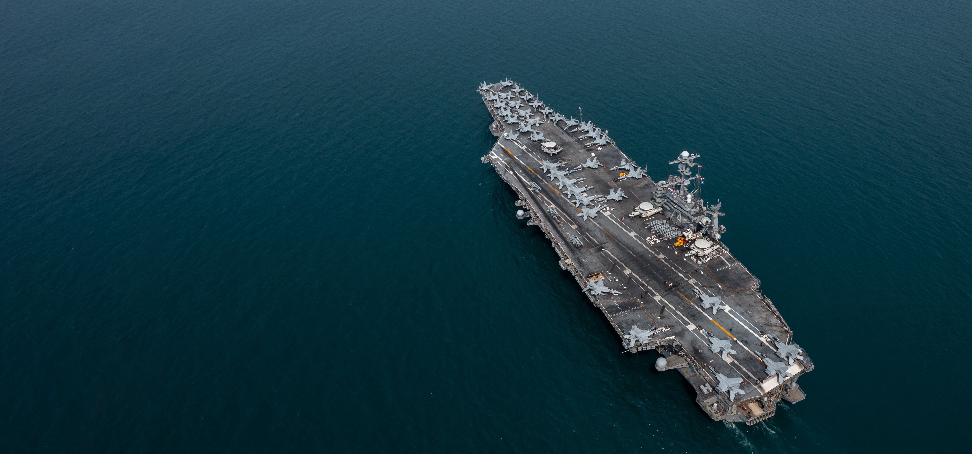 Aerial view military nuclear ship navy ship carrier full loading fighter jet aircraft, Aircraft carrier nuclear warship battleship, Military nuclear ship on the ocean.