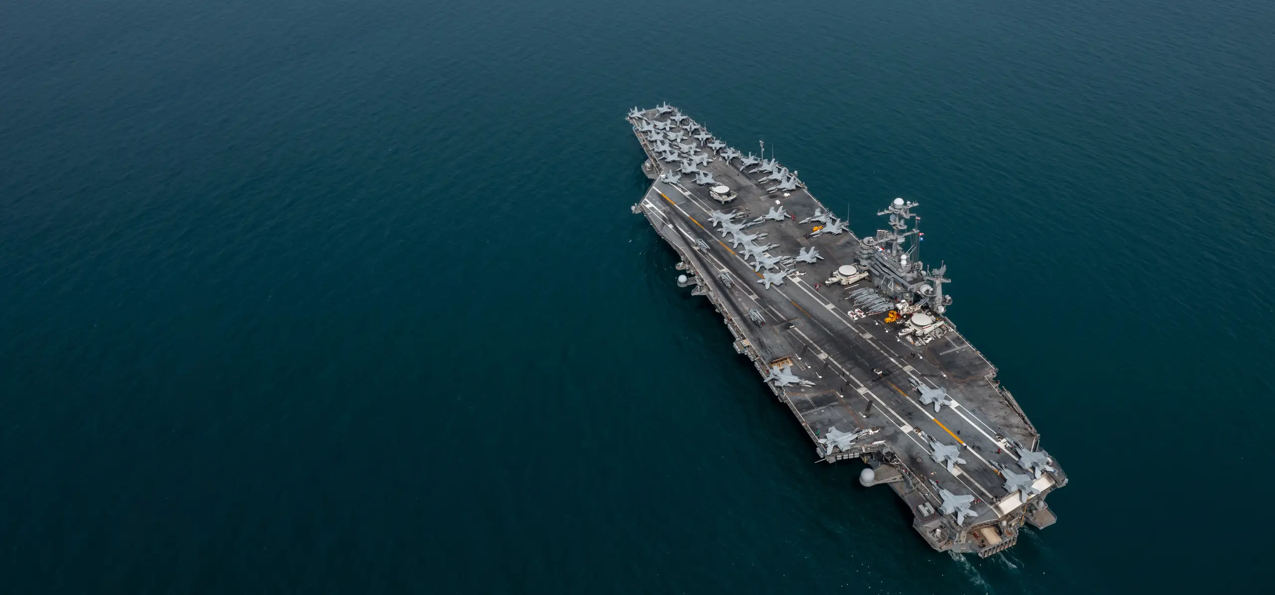 Aerial view military nuclear ship navy ship carrier full loading fighter jet aircraft, Aircraft carrier nuclear warship battleship, Military nuclear ship on the ocean.