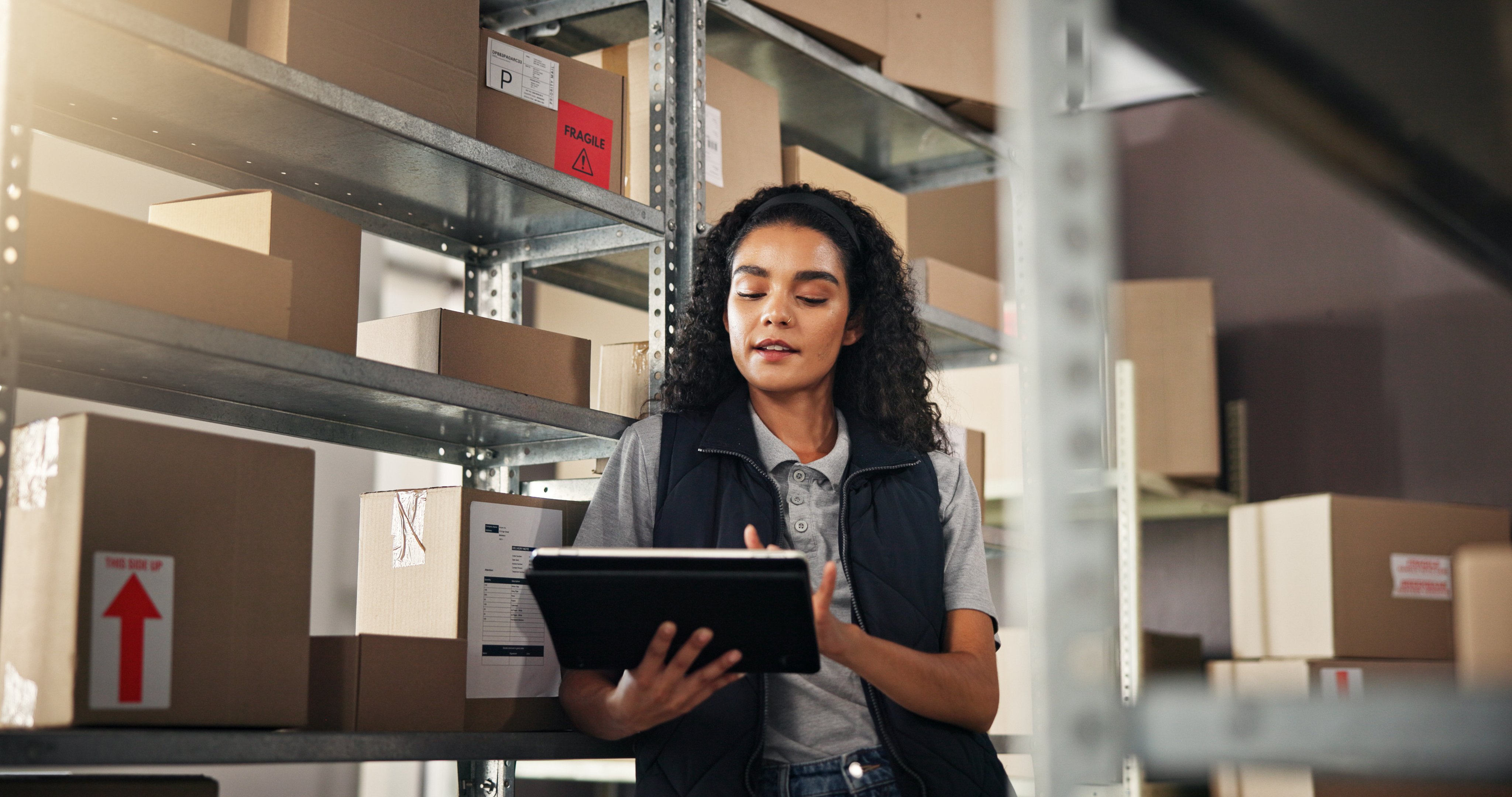 Supply chain, woman and search with tablet for delivery, distribution or quality control for ecommerce. Small business, warehouse and employee inspection for planning, shipping or supplier stock.