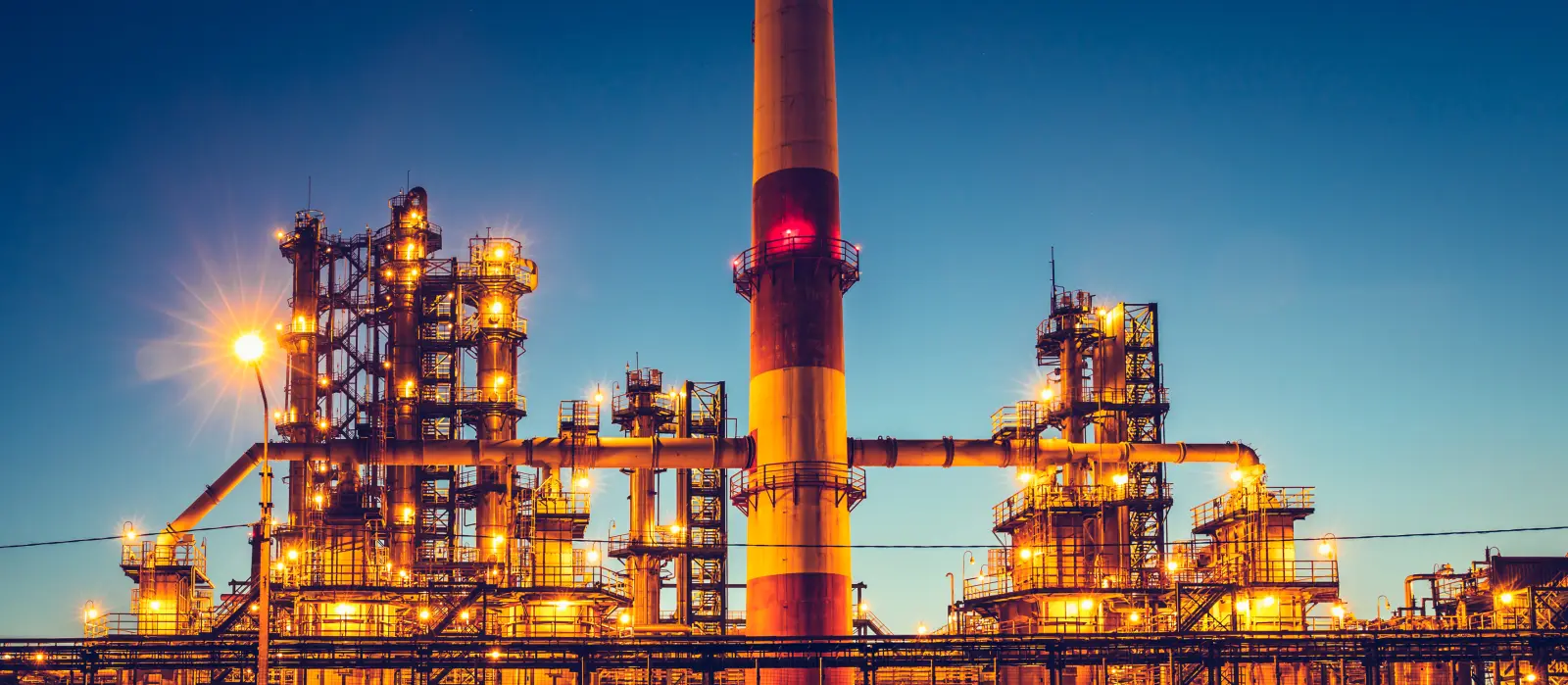 Panorama of Oil refinery industrial plant or factory, storage distillery tanks and steel pipeline, modern petrochemical technologies, toned