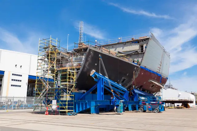 Ship under construction in a modern shipyard