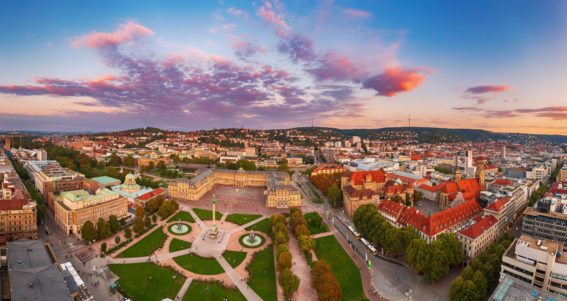 Aerial panoramic view of the famous Schlossplatz in Downtown Stuttgart, Germany at sunset, travel background