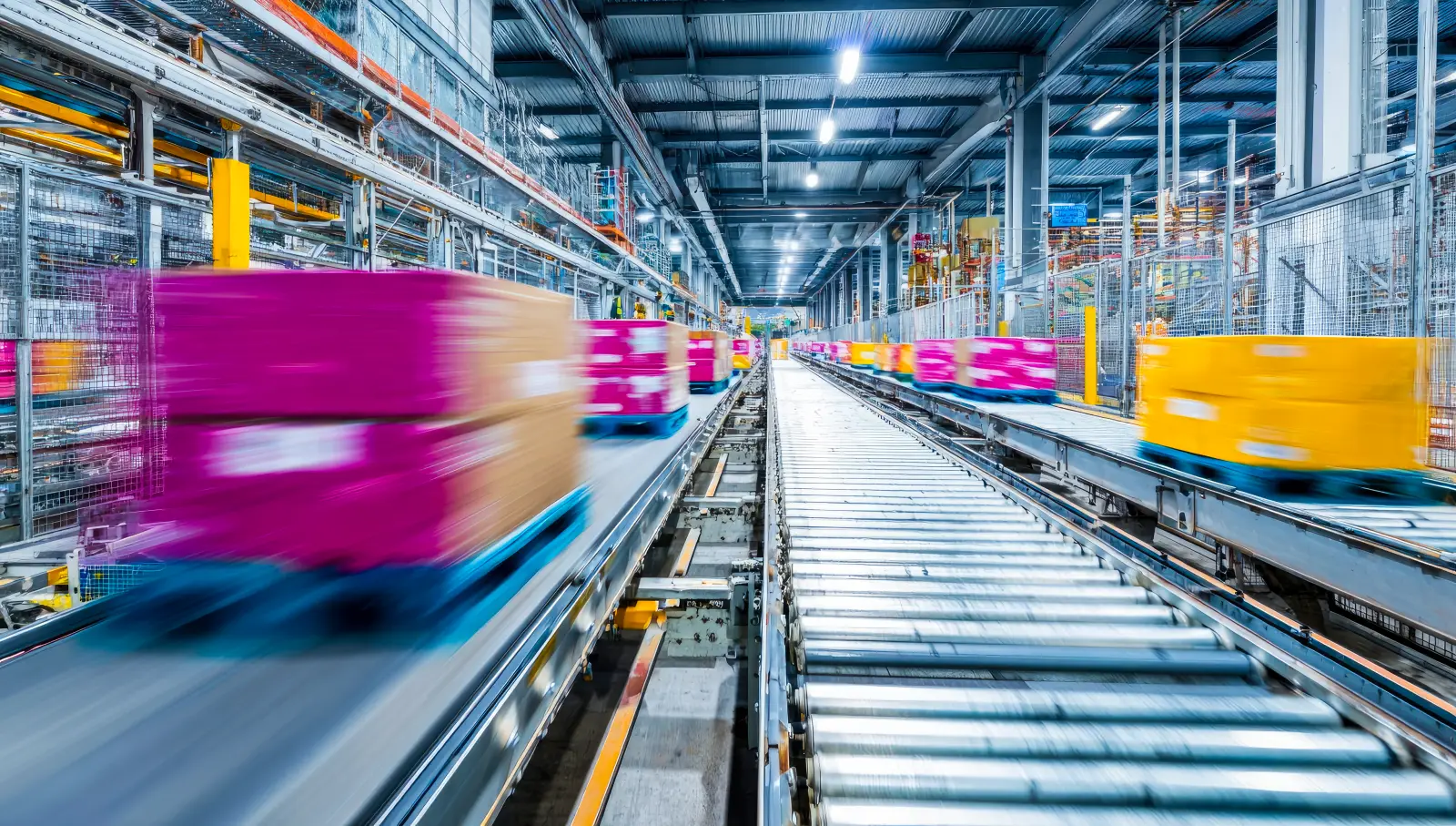Inside a bustling warehouse, automated conveyor belts swiftly transport colorful boxes, illustrating a modern logistics system in action. Efficiency and speed are key.