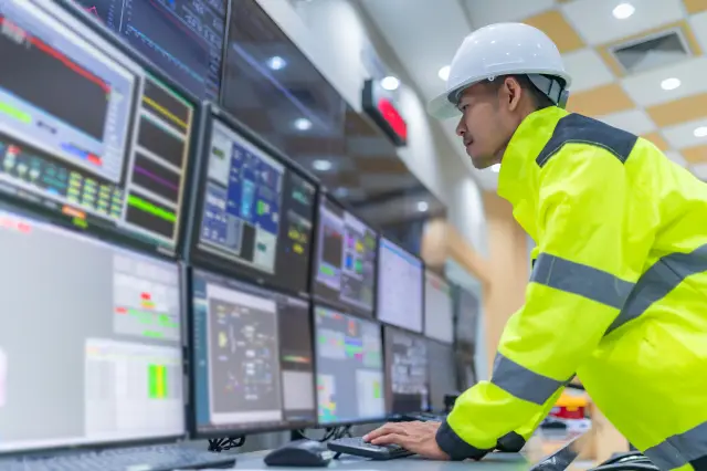 Engineer working at control room,Manager control system,Technician man monitoring program from a lot of monitor