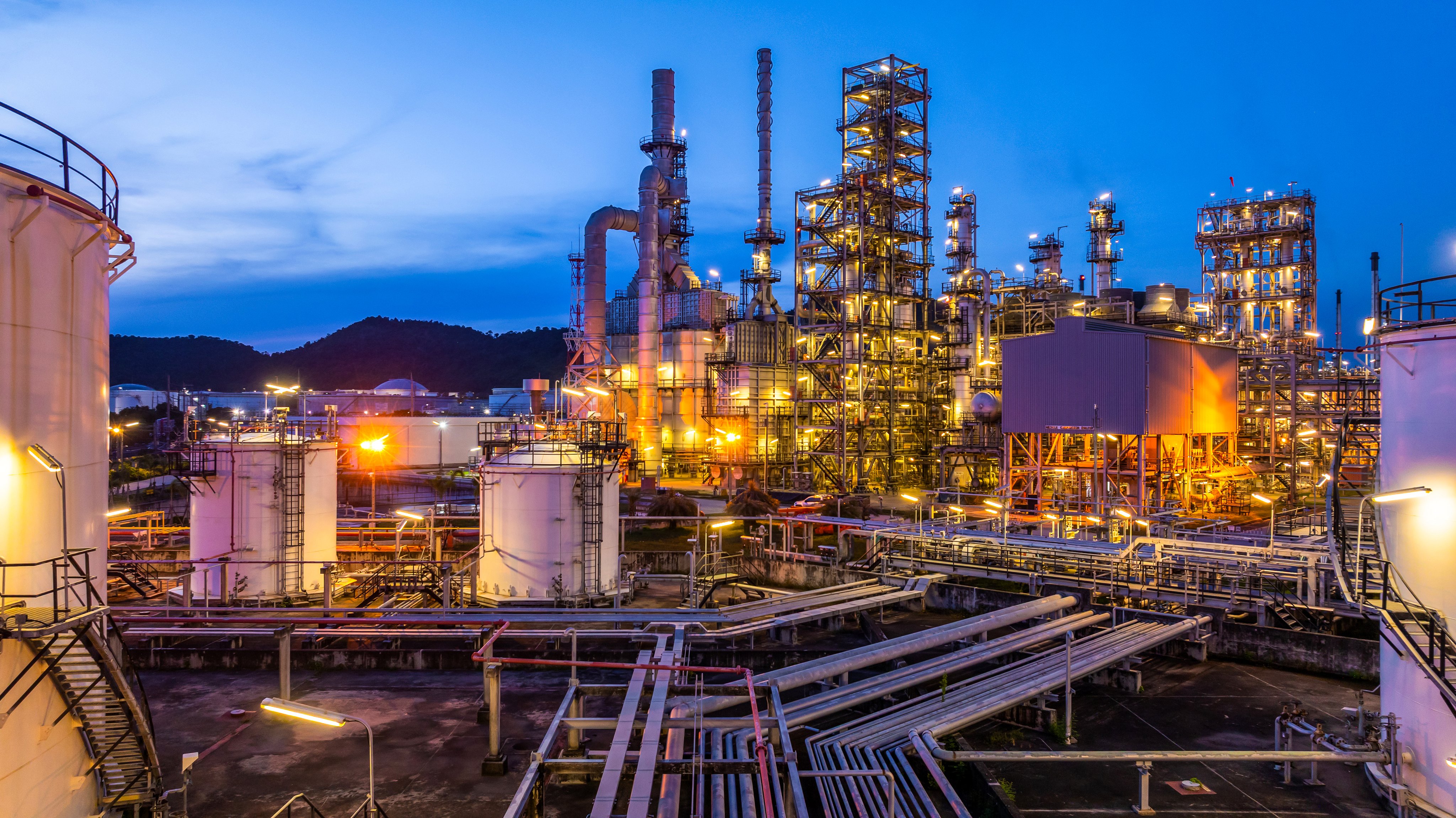 Oil and Gas refinery plant at night, Global business energy logistic transportation, Oil and gas refinery petrochemical industrial, Petrochemical refinery industrial energy supply chain.