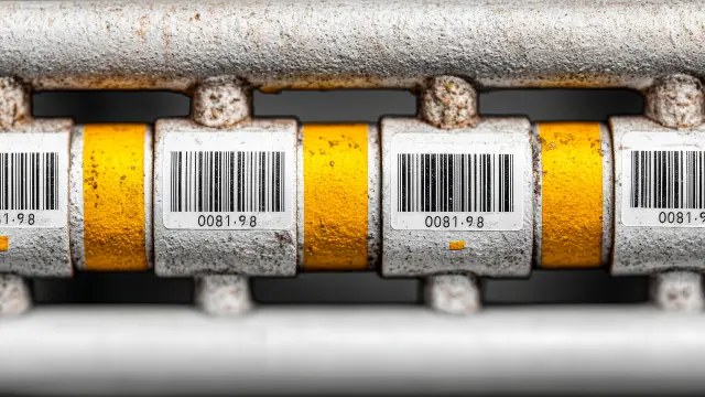 minimalistic stock photo, close-up of tagged utility pipes underground, barcode and label info visible, clear focus and symmetry, white, yellow, Canon EOS R5 RF 100mm f/2.8 Macro, --chaos 25 --ar 3:2 --stylize 250 --v 7 Job ID: 33a2fd24-a4fa-4b67-9485-de9a6bc0d1dc