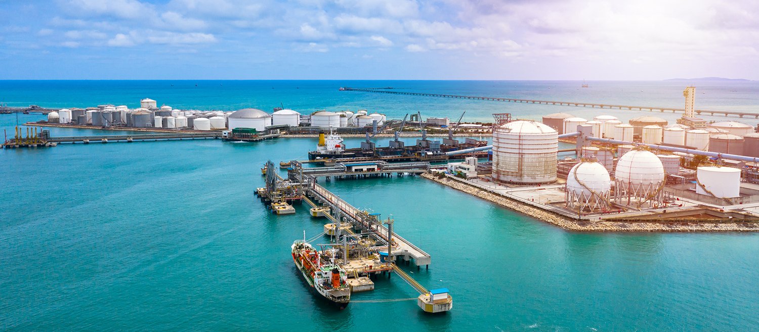 Aerial view white storage tank of oil and gas and petrochemical products ready for logistic and transport business.