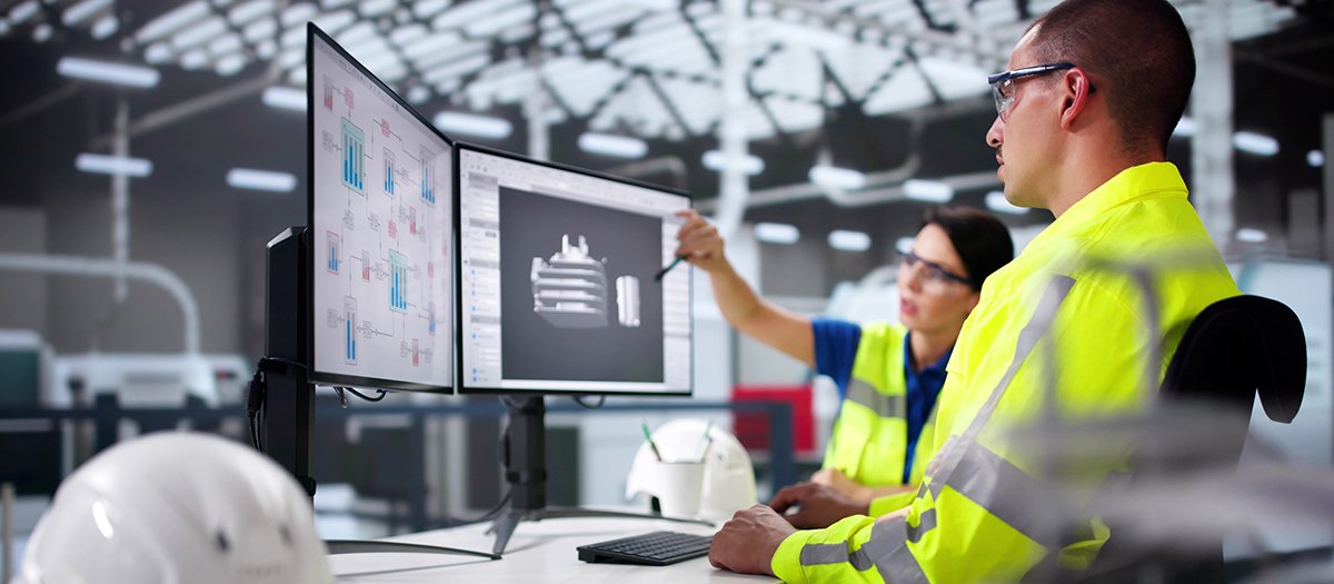 Engineer Doing 3D CAD Model Design On Computer At Factory