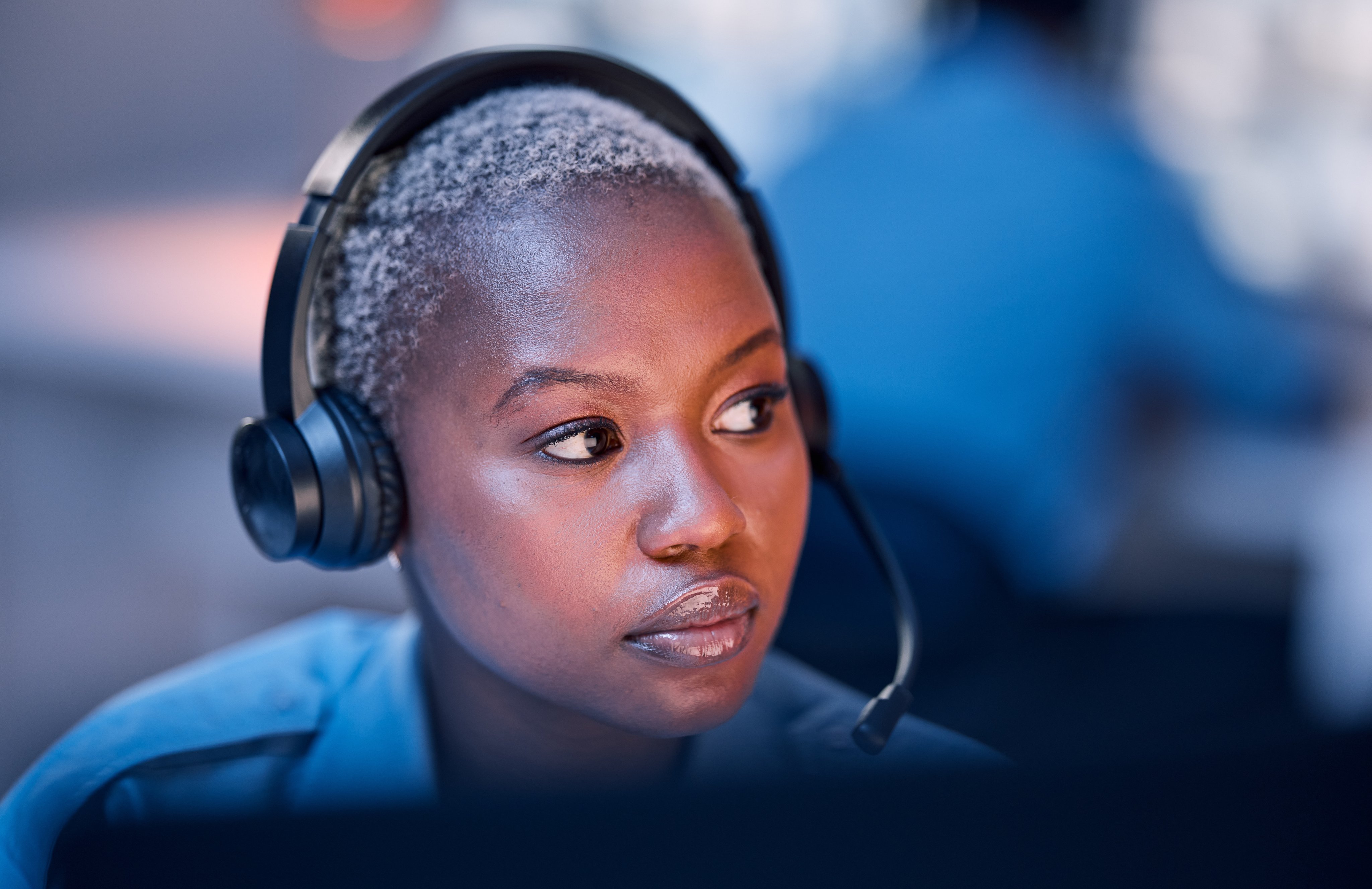 Safety, security or woman in call center for emergency or legal service thinking of danger in office at night. Worker, law patrol or face of female police contact agent with headset for communication.