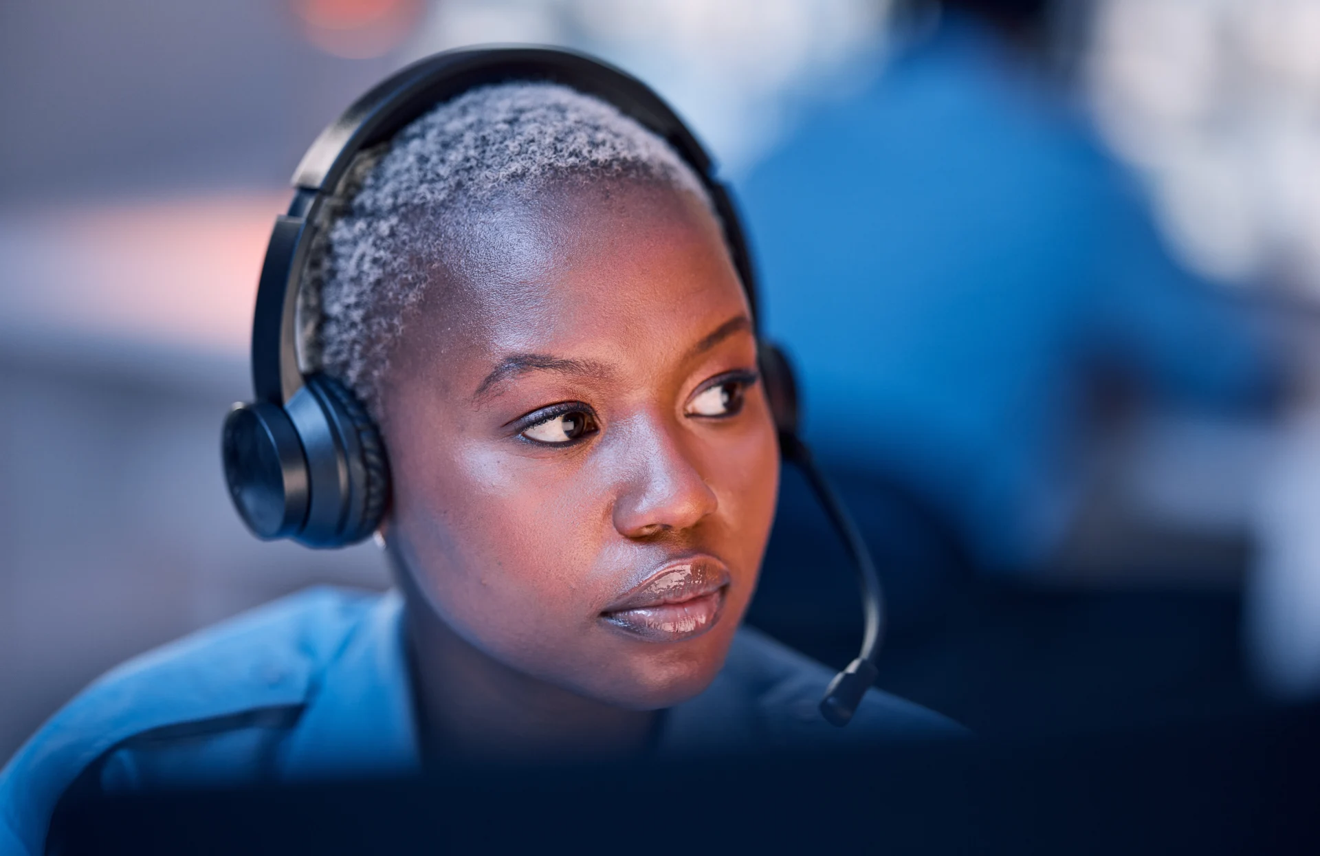 Safety, security or woman in call center for emergency or legal service thinking of danger in office at night. Worker, law patrol or face of female police contact agent with headset for communication.