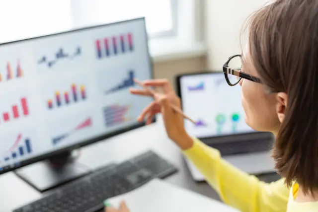 Caucasian advisor financial business analytics woman with data dashboard graphs