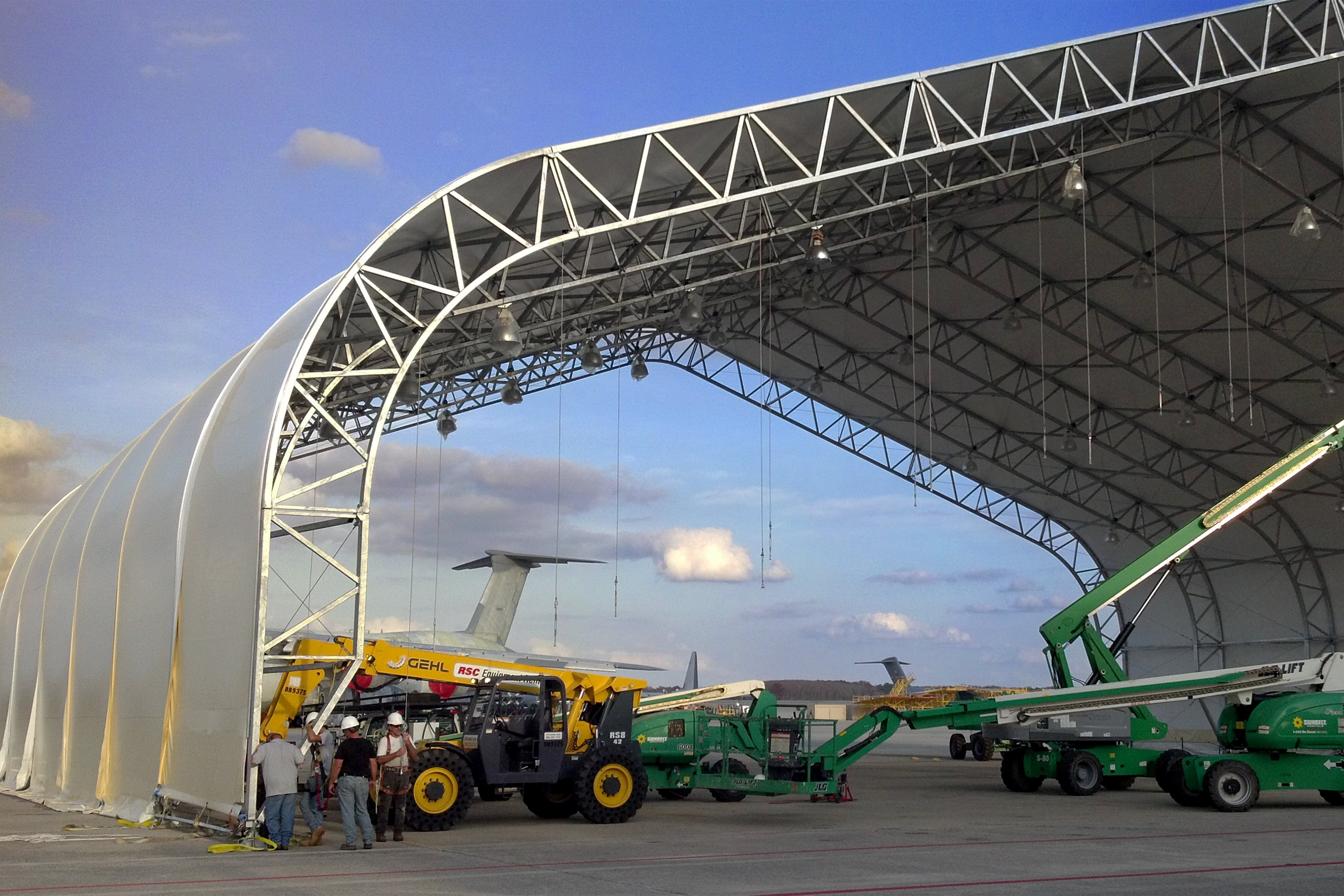 Clearspan fabric building under construction with lifts in place