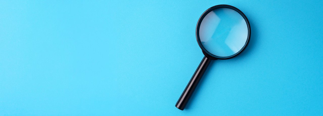 magnify-glass-blue-background