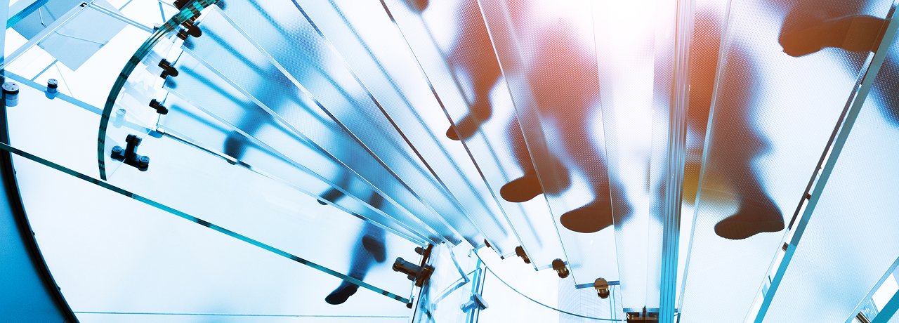 people-walking-on-glass-staircase