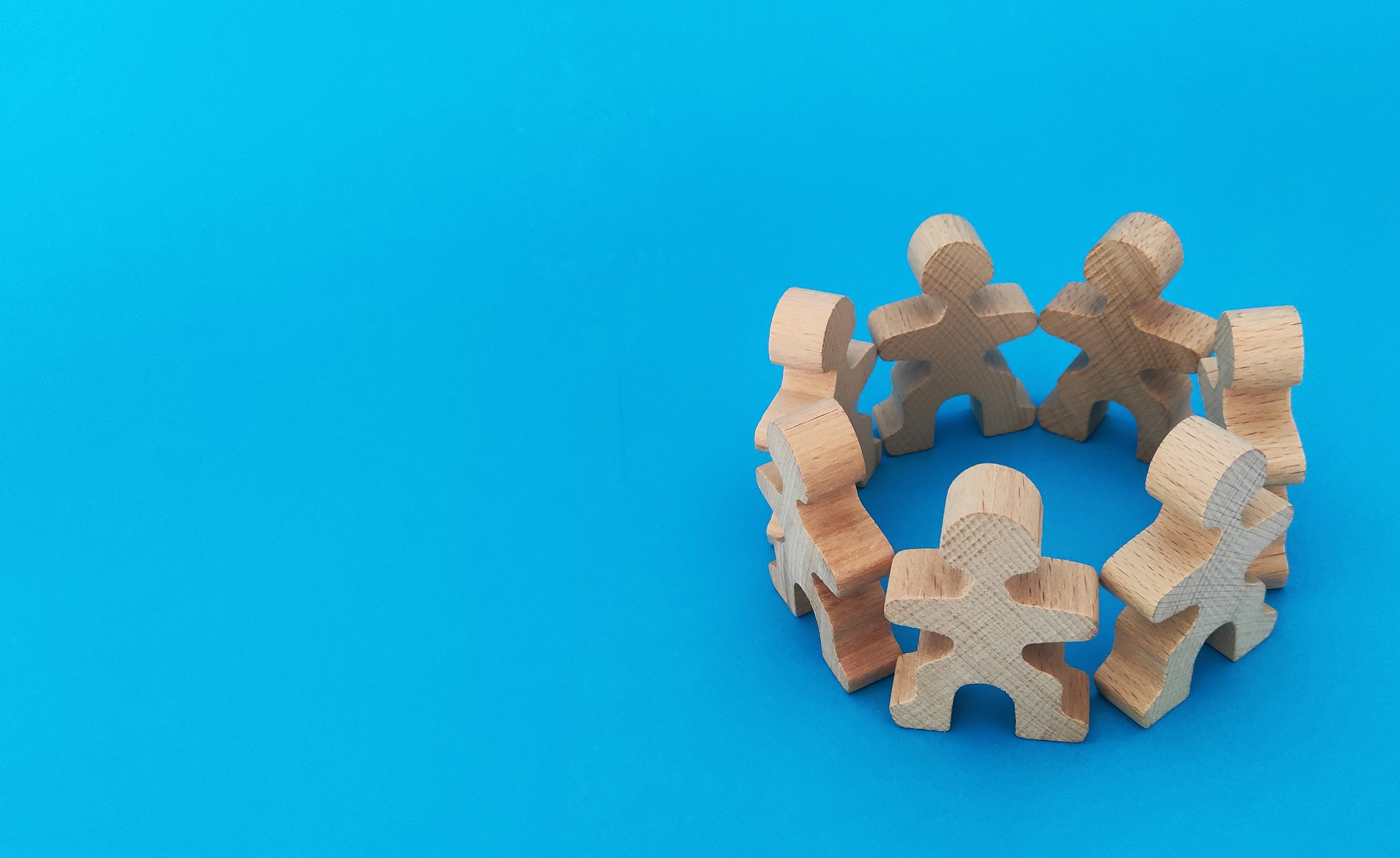 wooden figures on a blue background
