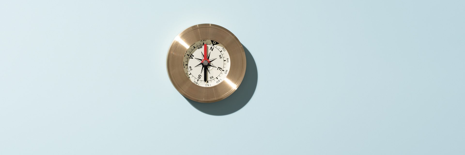 a compass on a blue background
