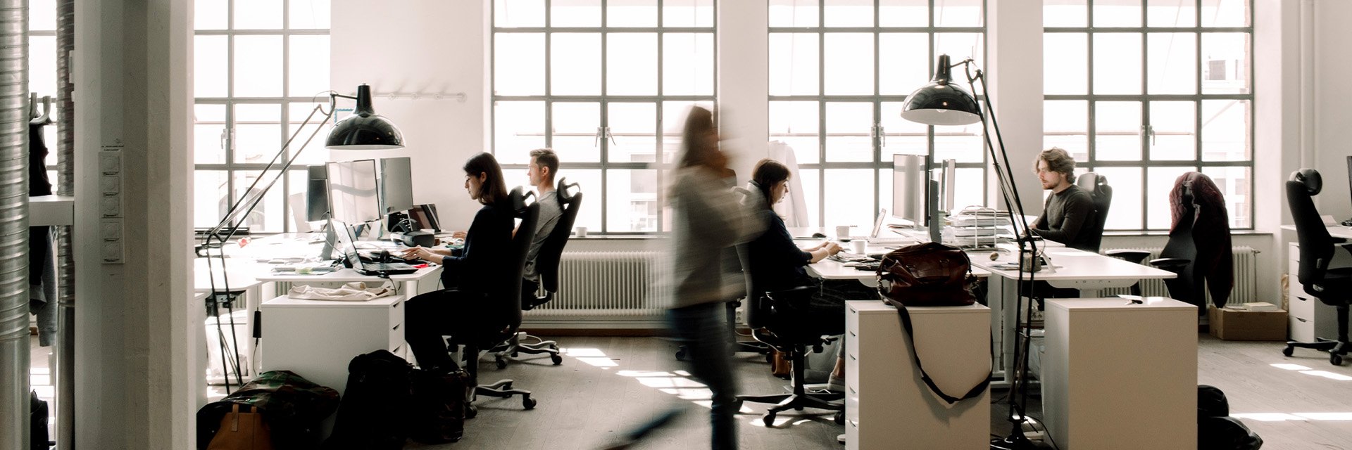 people-in-motion-working-in-large-office