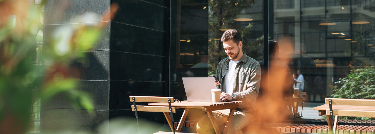 benefits-man-working-on-laptop-outside