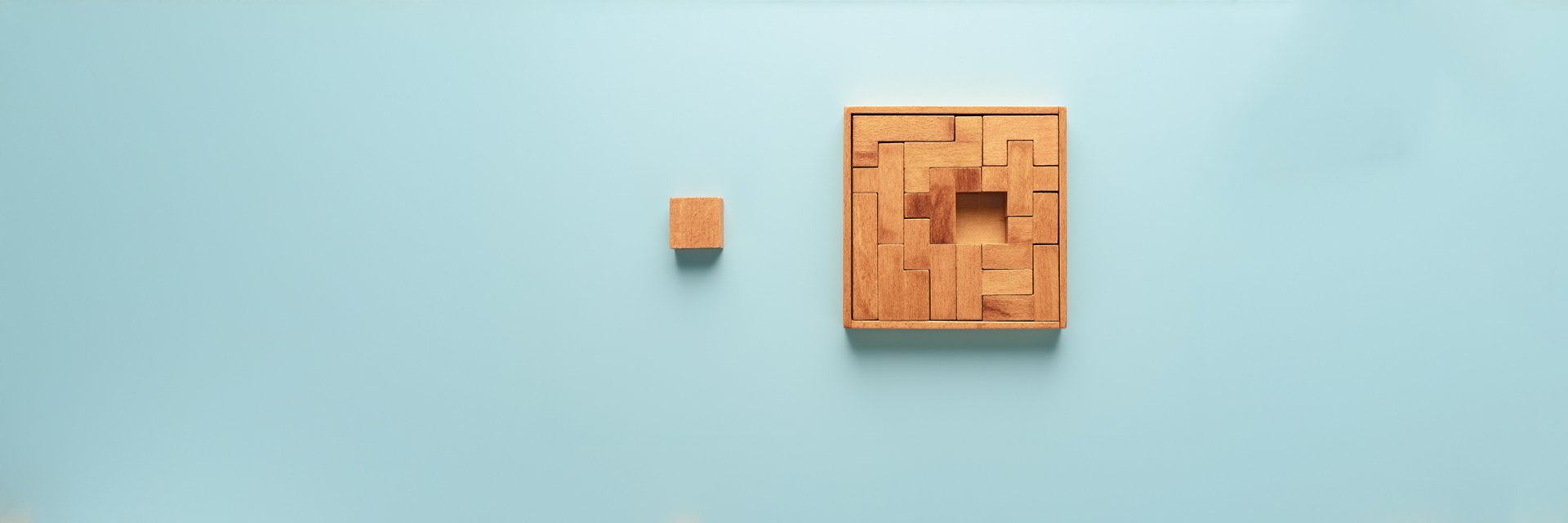 a wooden puzzle on a blue background