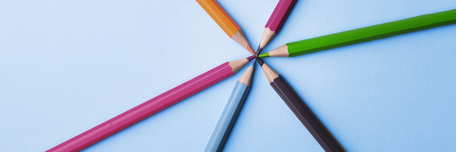 colored pencils in a starburst pattern on a white background