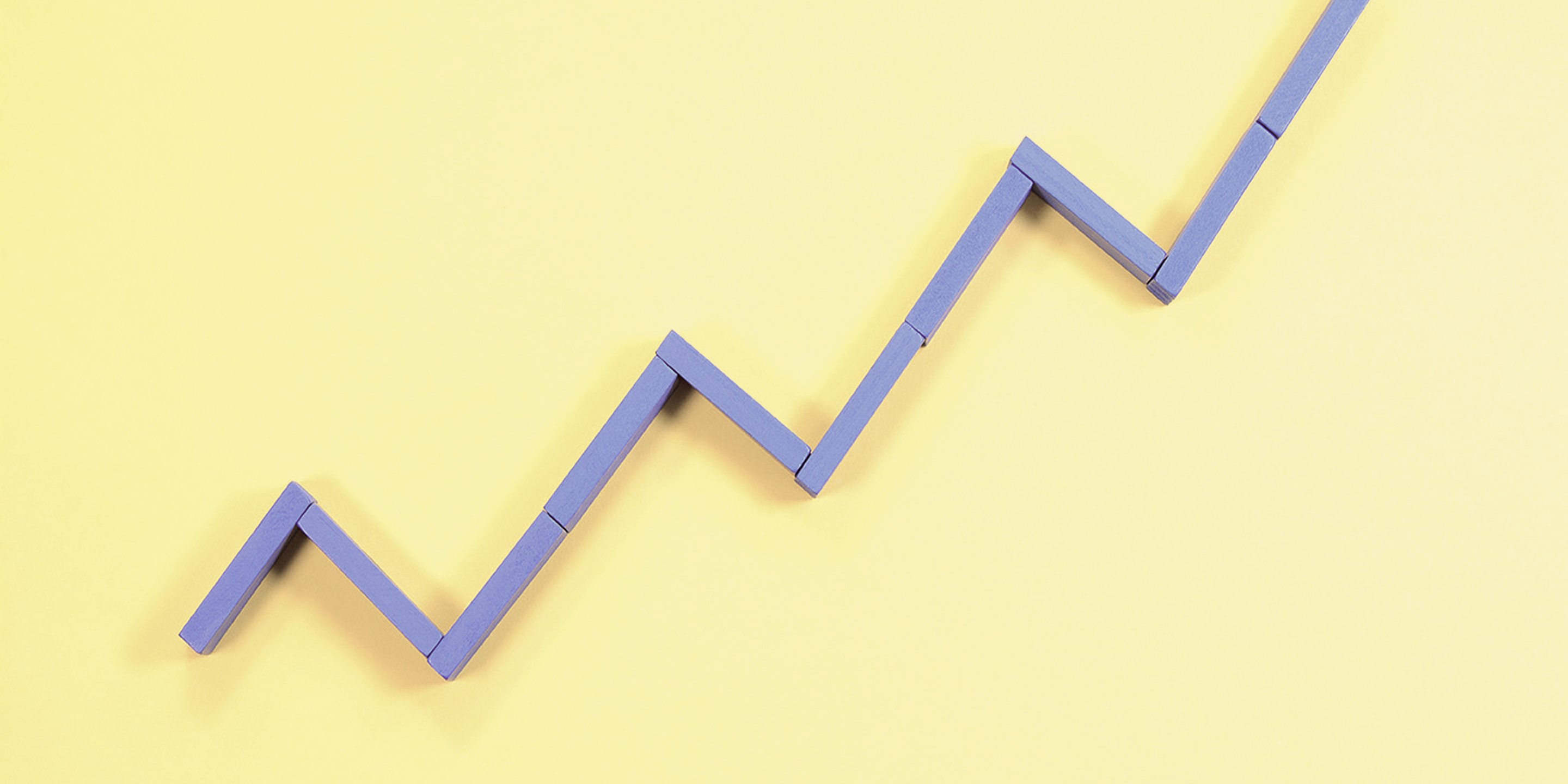 a three dimensional line graph with an upward trend on a purple background