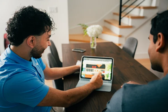 homeowner learning about how many watts it takes to run their house
