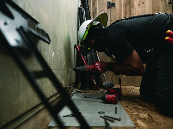 Sunrun solar panel system installer working on a house