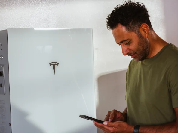 man with sunrun home energy storage system
