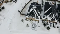 21_Robert S_ Aerial view of snowy house and panels_Southwest_TX