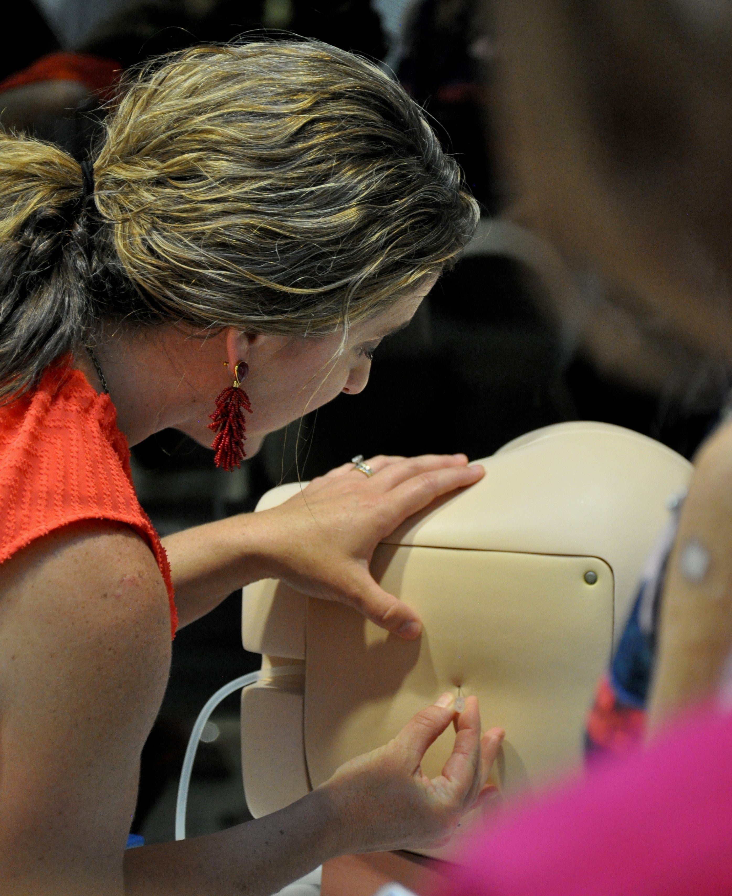 Mini-Medical School participants practicing administering pediatric lumbar punctures.