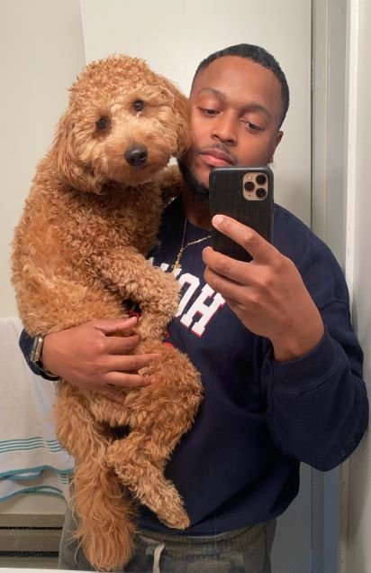 University of Virginia Jayson Esdaille, MD, Surgery Resident with puppy.