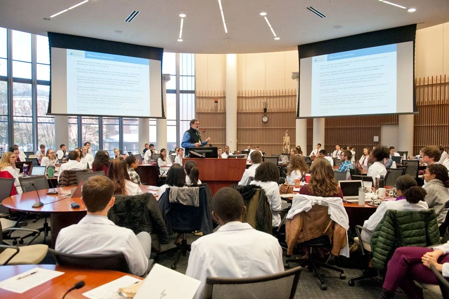 UVA medical students attending lecture in the Medical Education classroom