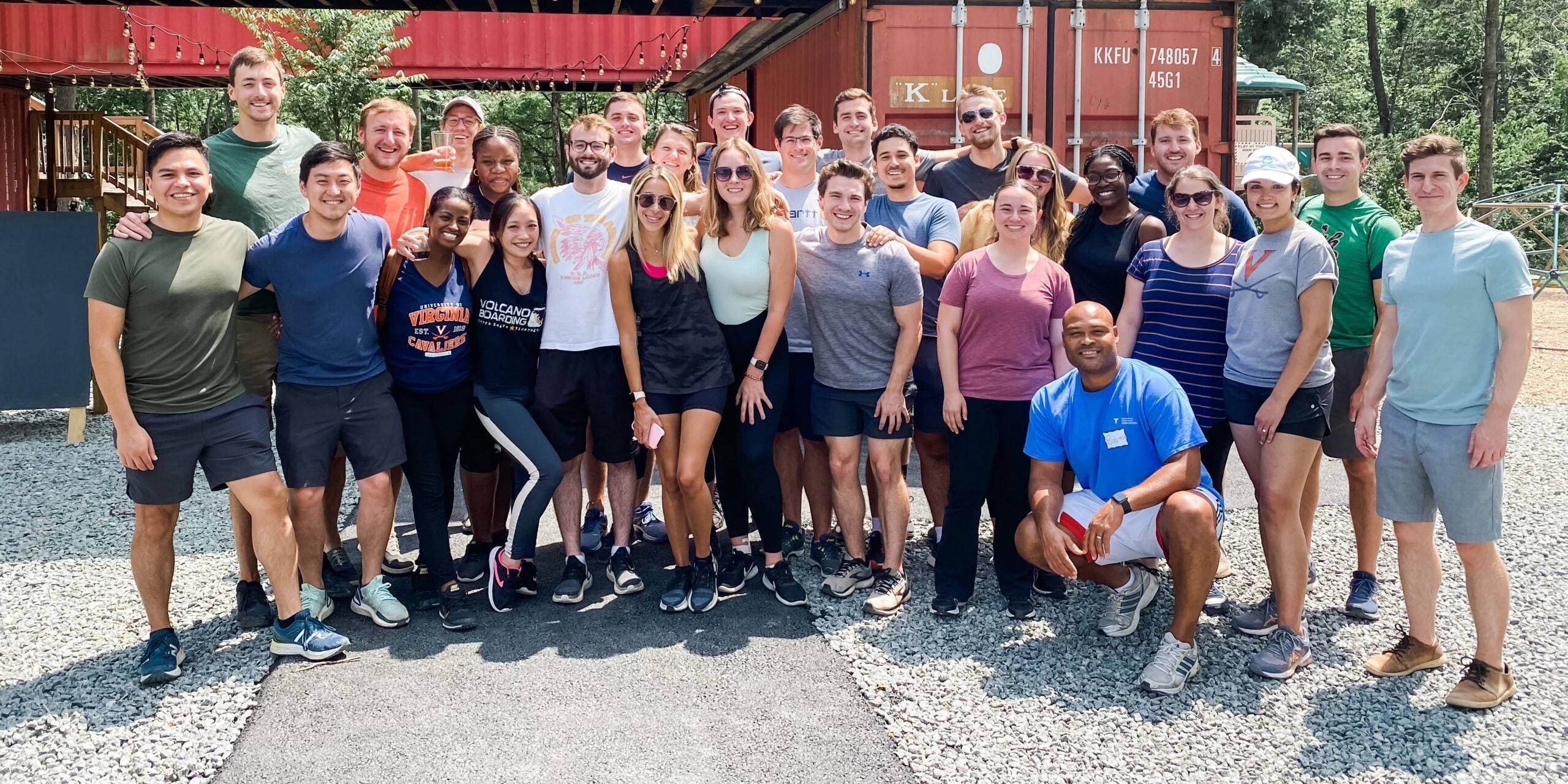 group photo of the residency program outside at a team event
