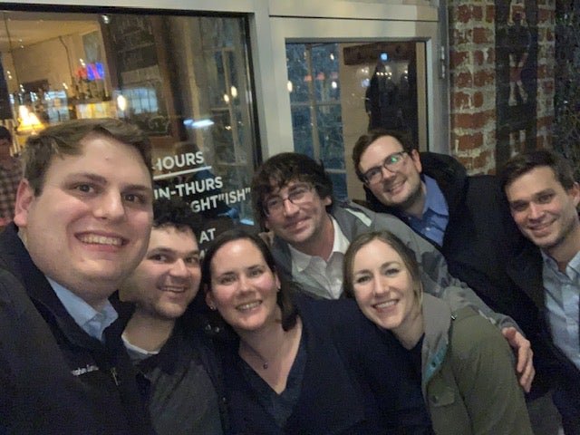 The residents enjoying dinner with Dr. Janowski