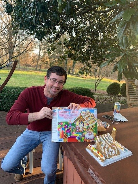 Resident David building a gingerbread house