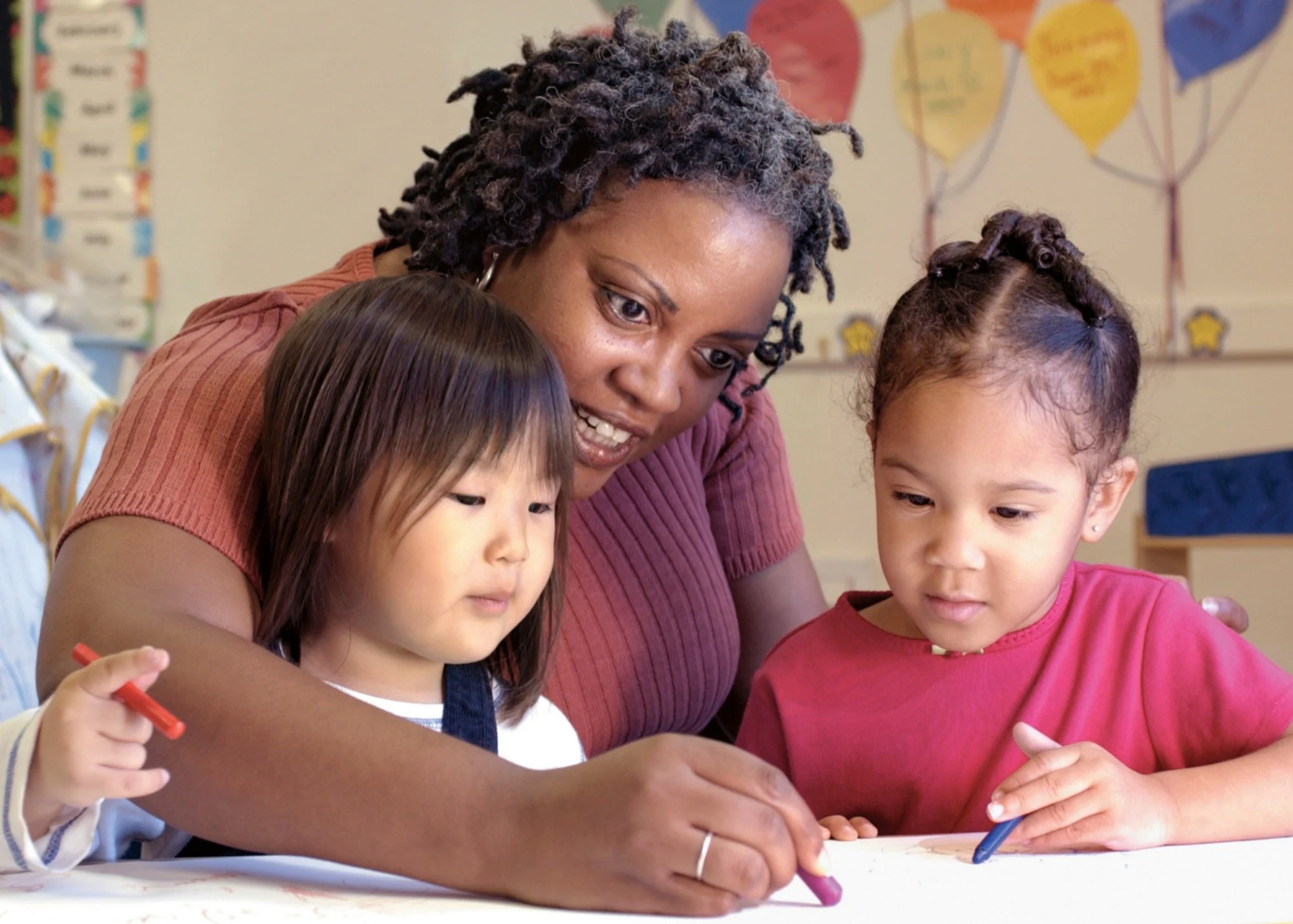 pre-kindergarten teacher and student